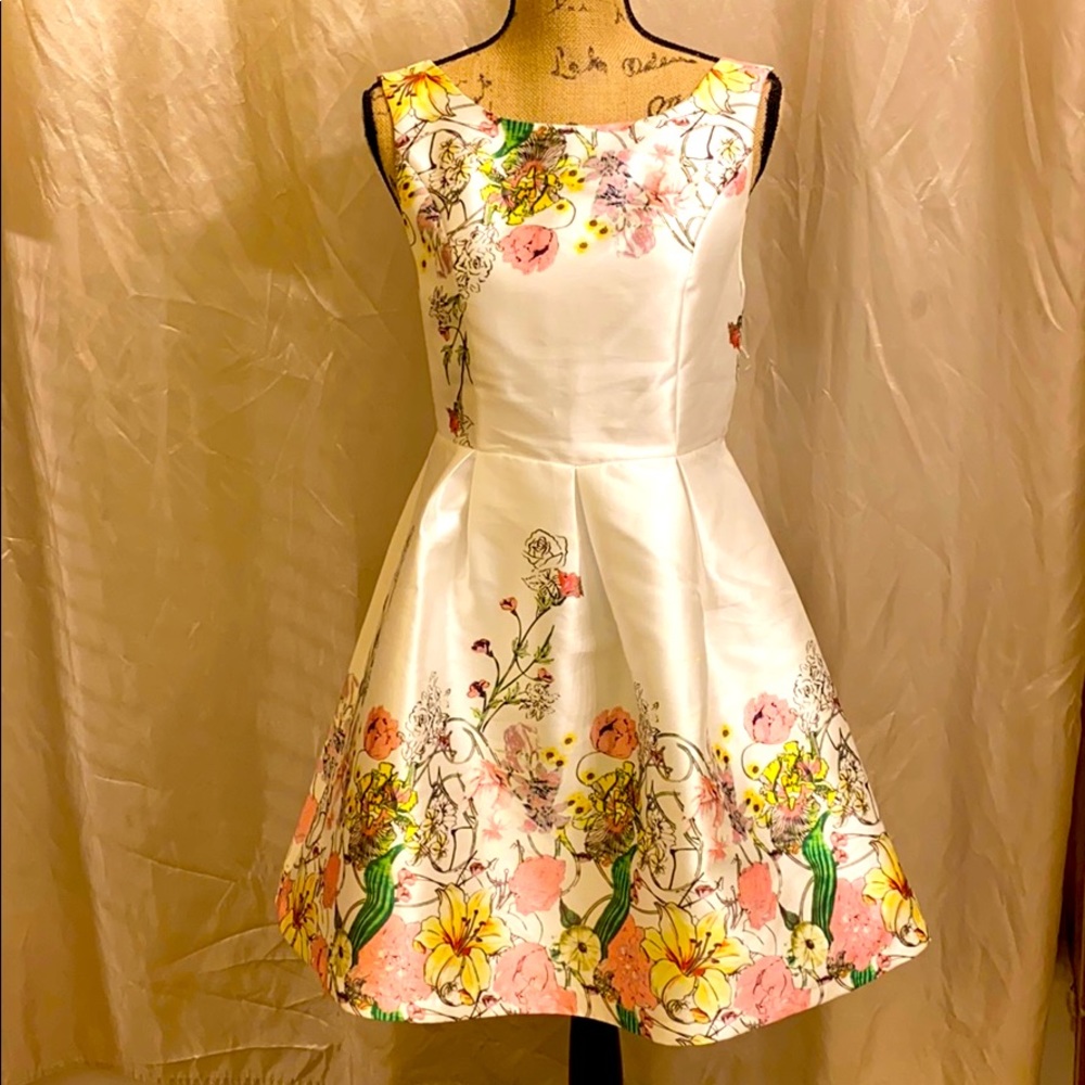 Sleeveless white dress with floral print highlight